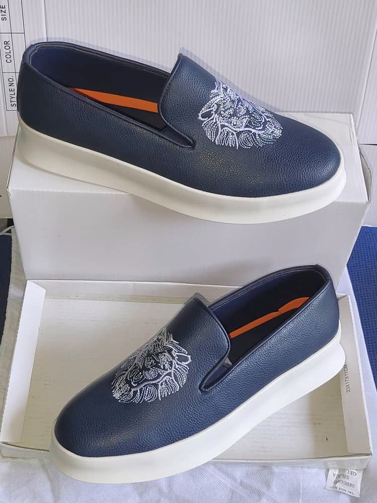 Mocassins en cuir avec tête de lion