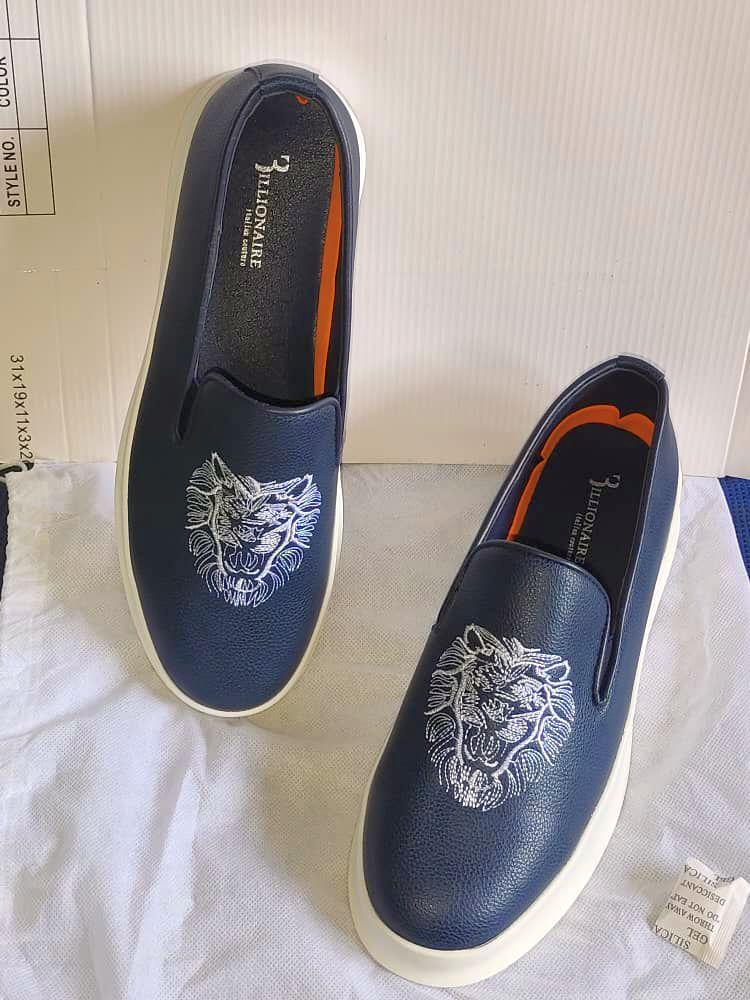 Mocassins en cuir avec tête de lion